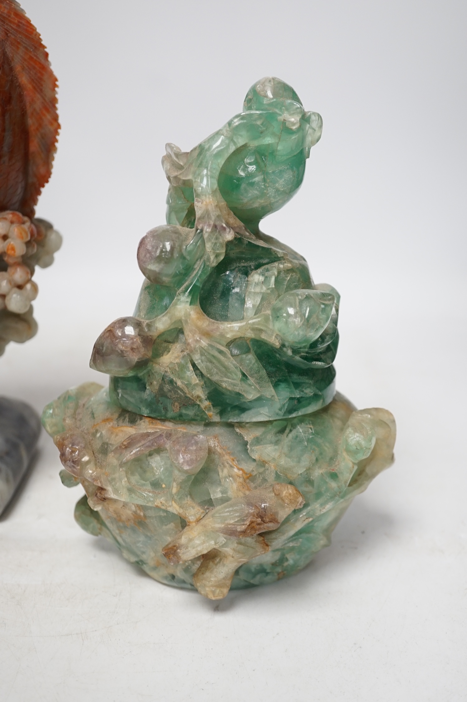 A Chinese carved soapstone figure of a leaping carp and a green quartz pot and cover, tallest 29.5cm high. Condition - fair
